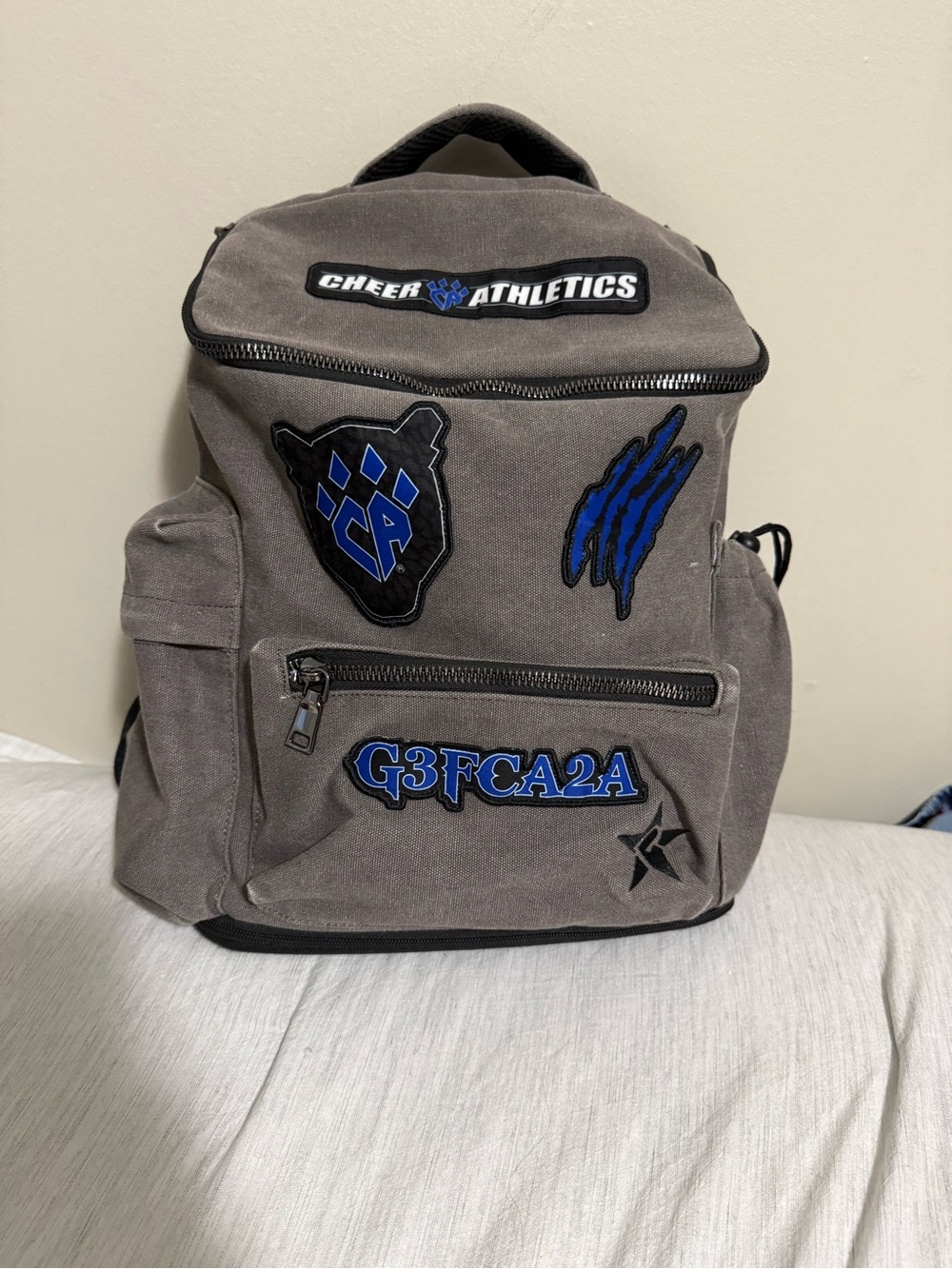 Gray Canvas Backpack with Blue Patches